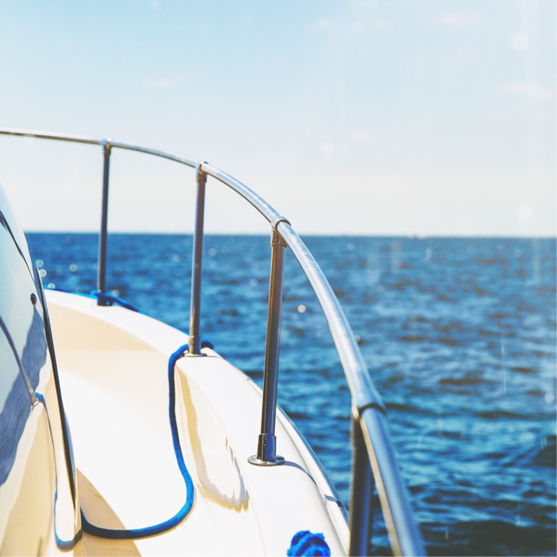 The side of a boat looking out on the water