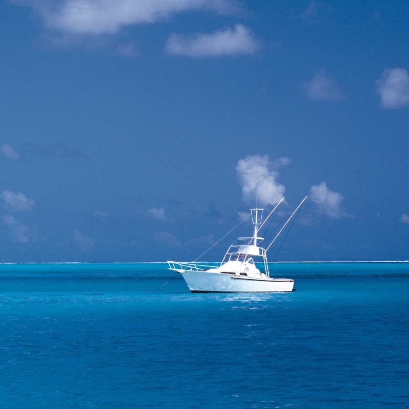 A white boat in the middle of the sea